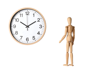 A wooden mannequin stands next to a clock showing the time, isolated on a white background.