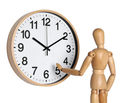Wooden mannequin adjusting the time on a simple, round wall clock.