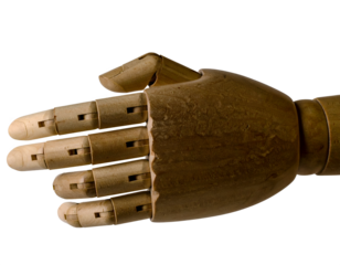 Wooden mannequin in mid-air, arms and legs outstretched, isolated on white background.