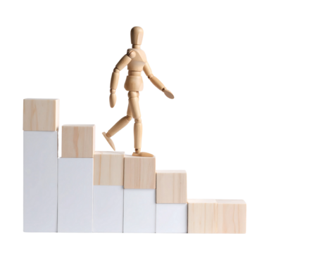 Miniature Figure Ascending Wooden Blocks to Reach Goal