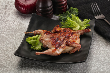 Grilled quail in the plate