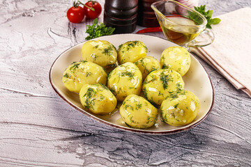 Young boiled potato with dill