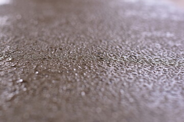 raindrops on pavement, Rain drops on asphalt or tarmac road creating ripples, The floor is covered with moss from rain