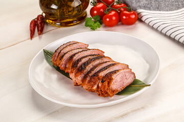 Sliced duck breast baked with cherry