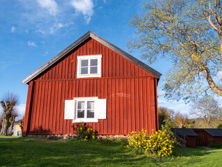 Charming Red Wooden House Surrounded by Nature