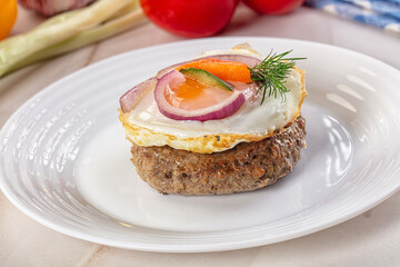 Beefsteak chop with roasted egg