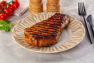 Grilled pork steak with bone