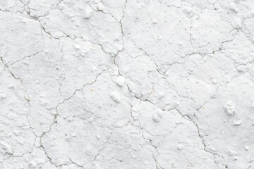 White wall with cracks and holes