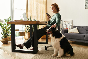 Home relaxation with a playful dog while using a smartphone in a cozy setting