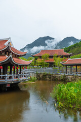 Vietnamese Picturesque Village Near River Among Mountains And Jungle