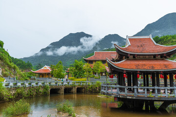Fototapeta premium Vietnamese Picturesque Village Near River Among Mountains And Jungle