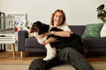 Young man enjoys a cozy moment at home with his playful dog on a sunny afternoon