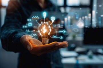 Hand holding a glowing lightbulb with dollar sign, financial data overlay