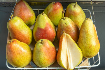 Ripe Juicy Pears at the Farmers Market. A Bountiful Harvest of Pears Celebrating Nature's Sweetness and Abundance. The Essence of Simplicity and Wholesomeness Found in Fresh Pears.