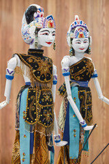 Traditional Indonesian handcrafted female dancers puppets. Asian artwork.