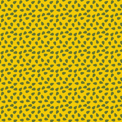 Abstract Pattern of Green Droplet Shapes on Yellow Background