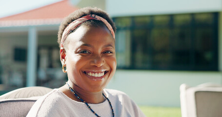 Portrait, smile and black woman at backyard for relax, chill and peace in morning by home. Happy African person, house and resting outdoor for calm, break and fresh air in garden on weekend in Kenya