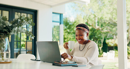 Coffee, laptop and smile with black woman in home for banking loan, wealth management and review....