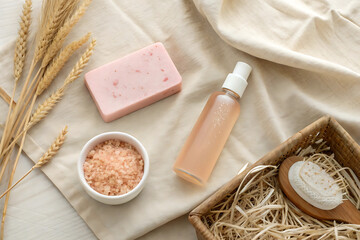Natural beauty products flatlay with wheat