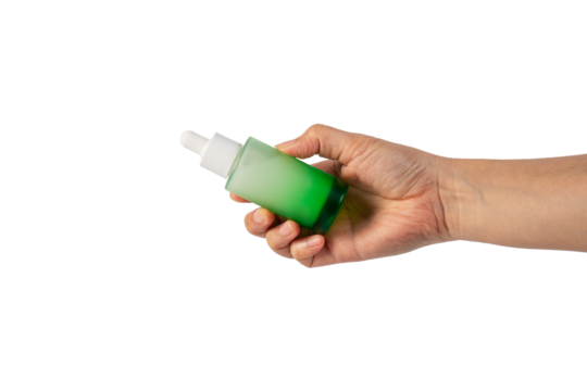 Green glass cosmetic bottle, Skin care or sunscreen cosmetic with hand on transparent background.