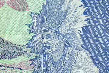 Macro of indigenous man on indonesian one thousand Rupiah bank note