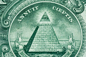 Macro of One US Dollar bill pyramid all seeing eye front side of American currency straight 1