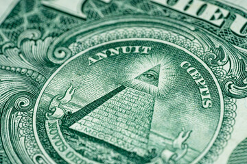 Macro of One US Dollar bill pyramid all seeing eye front side of American currency tilted 2