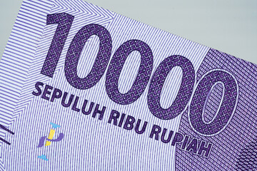 Macro of ten thousand indonesian Rupiah bank note currency number value