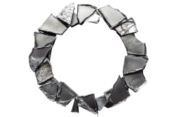 Circular frame of broken, dark gray shards