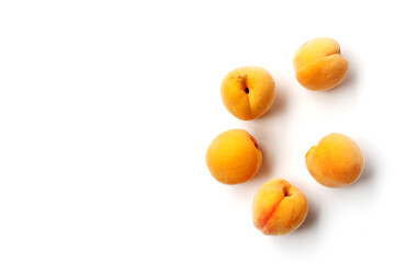 Fresh ripe apricots on a white background.