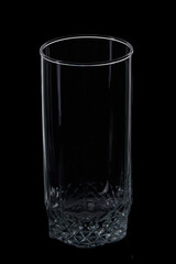 Empty tall glass on black background