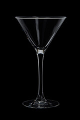 Empty transparent martini glass on black background