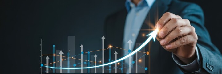 Businessperson drawing a rising graph.