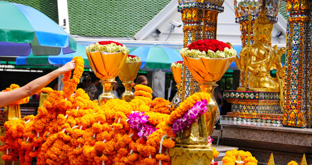 Marigold flower garlands offered for worship at the Erawan Shrine in Bangkok, Thailand.