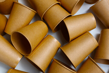 Brown paper cups on white background.