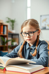 Focused Girl Reading in Classroom