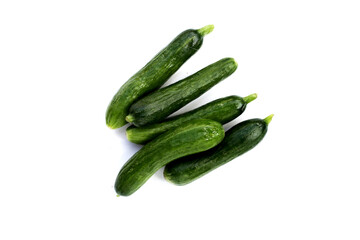 Mini cucumbers on white background.
