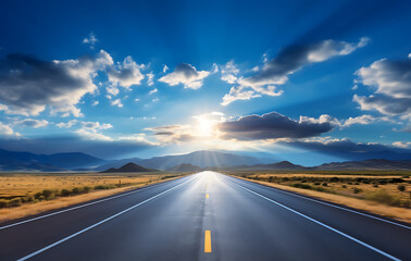 Road to the horizon: An expansive, clear sky filled with fluffy clouds hangs above a straight road disappearing into the horizon. This picturesque view evokes feelings of freedom and travel. 