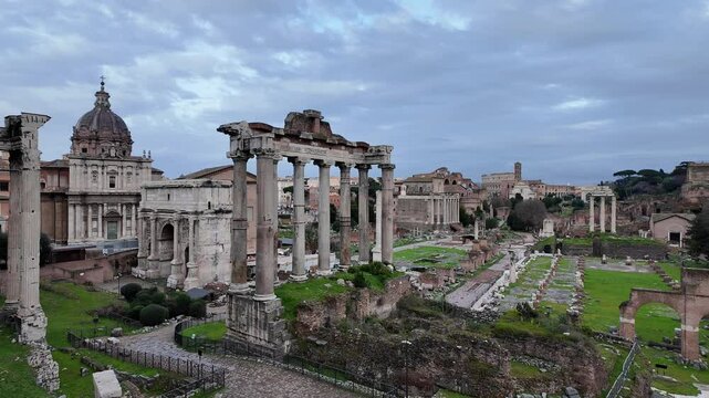 Rome, Italy: Panoramic footage of the ancient Roman forum with ancient temples and catholic churches in Rome, Italy capital city.