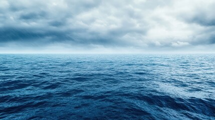 Fototapeta premium Seascape Under Cloudy Sky: A tranquil depiction of vast open ocean stretching towards the horizon, under a sky filled with dramatic clouds. A powerful and evocative scene of nature's beauty.