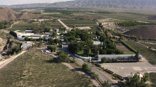 DRONE: ORBIT SHOT OF CASA MADERO WINERY IN PARRAS, COAHUILA IN THE DESERT OF MEXICO