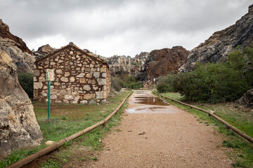 ruins of old houses at Cerro del Hierro Natural Monument at Sierra Norte natural park, province of...
