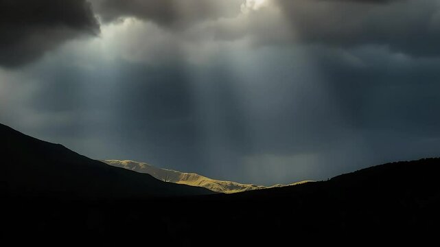 God Rays Breaking Through Clouds Over Hills