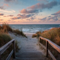 Coastal path leading to a beach at sunset