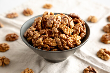 Raw Walnut Halfs in a Bowl, side view. Close-up.