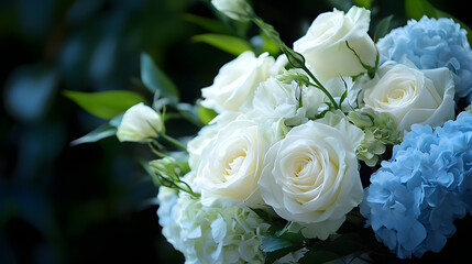 Obraz premium A refined bouquet of white roses and pale blue hydrangeas.