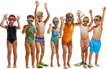 Seven kids in swimsuits and goggles stand in a row with their hands up, smiling and playing together.