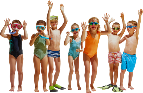 Seven kids in swimsuits and goggles stand in a row with their hands up, smiling and playing together.