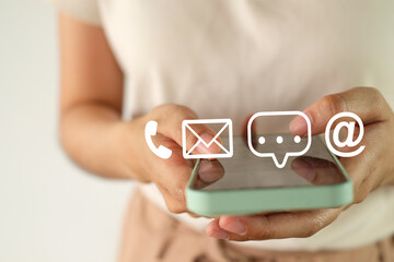 Technology,Business concept.,Close up hand's woman using her mobile phone to contact customer...