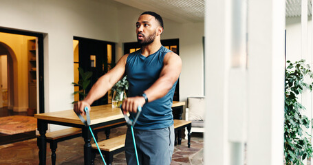 Fitness, man and resistance band to exercise muscle for strength, energy or power at home....